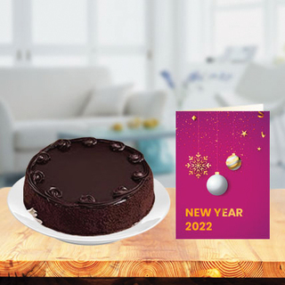 New Year Chocolate Cake with New Year Greeting Card