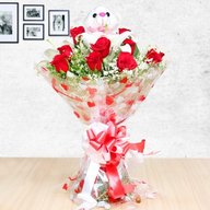 Elegant roses and lilies including teddy 