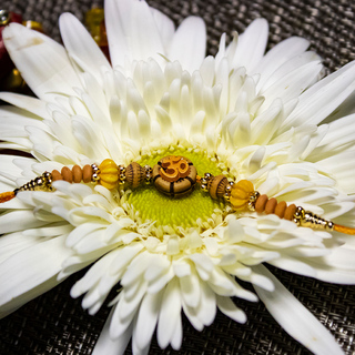 Exquisite OM Wooden Rakhi