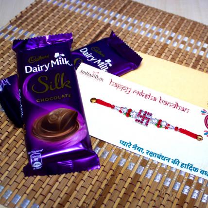 Shining Swastika Rakhi with Dairy Milk Silk Chocolates