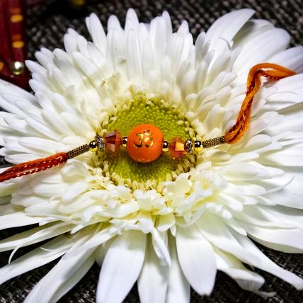 Om Orange Rakhi