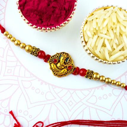 Golden Ganesha with stones Rakhi